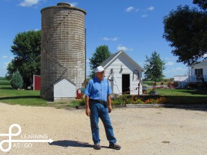 Ted explaining to us how the water tower (in the background) worked to provide water to the entire farm!
